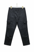 Black cargo pants hanging on a gray background