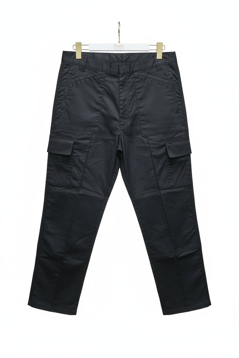 Black cargo pants hanging on a gray background